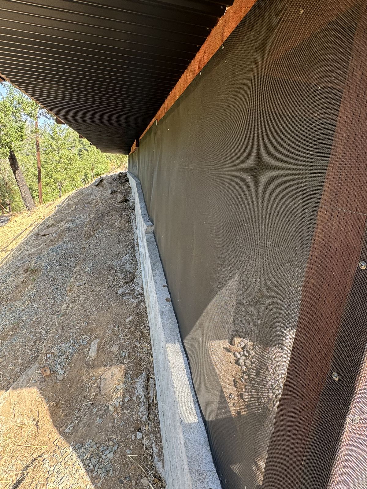 A fully sealed under-structure on a hillside rebuild, the kind of verified work that cures a nonrenewal